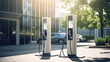 © Alina Tymofieieva - Electric vehicle charging station or electric vehicle charging stations with graphic display. Electric public charging powered by renewable clean energy. Concept of technology, ecology.