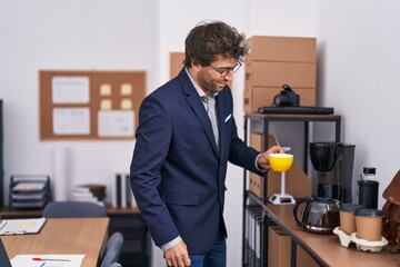 Sticker - Young hispanic man business worker drinking coffee at office