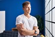 © Krakenimages.com - Young man standing with arms crossed gesture at home
