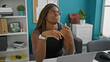 © Krakenimages.com - African american woman business worker using laptop thinking at the office