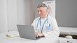 © Krakenimages.com - Young caucasian man doctor using laptop working at the clinic
