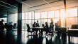 Blurred business people in glass office. business people in modern office. group of business people sitting around table and talking