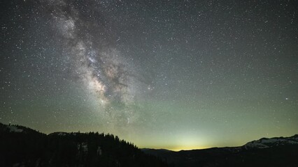 Wall Mural - beautiful time lapse of mountains with the stars moving across the night sky. shot near mammoth lake