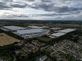 Canvas Print - Aerial view of Industrial Warehousing Raunds during cloudy weather in the UK