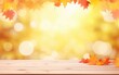 © Diffin - Wooden table and blurred Autumn background. Autumn yellow leaves banner
