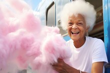 Beautiful Smiling 80 Years Old Woman Buying Pink Cotton Candy In Food Truck At The Festival