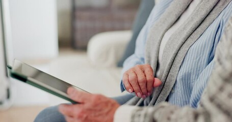 Canvas Print - Hands, senior and tablet on sofa for search, internet scroll or social media in living room of house. Person, technology or touchscreen for communication , streaming or news on couch in lounge