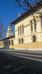 a view of an old school building and its clock tower