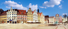 Panoramic Image Of Market Square In Wroclaw, Poland, Eastern Europe, On A Bright Day With Clouds. Wroclaw Is A Historical Capital Of Silesia. Panoramic Banner Image.