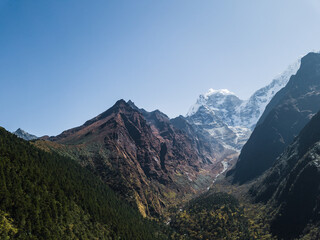  Mountain landscape of Nepal with snowy peaks with clouds in sunny weather