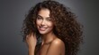 © ME_Photography - Portrait of a woman, skincare, and beauty cosmetics for shine, wellness, a happy model with curly beautiful hair smiling on a gray background