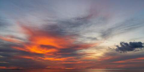 Wall Mural - abstract amazing scene of stuning colorful sunset or sunrise with clouds background in nature and tr