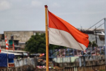 the Indonesian flag flutters in the sky