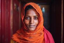 Portrait Of A Beautiful Indian Woman In Red Scarf Looking At Camera