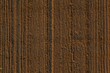 © Jiri Castka - Picture of an aerial view of a field with tractor tracks