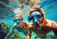 Couple Snorkeling To See The Beauty Of Coral And Sea Fish