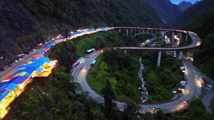 Wall Mural - Aerial 4k video of Kelok 9 bridge at night. A popular bridge in Sumatra to commute between cities.