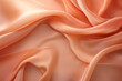 Silken peachy fabric flowing in soft waves. Luxury textiles. Peach Fuzz 2024. Ideal for interior design backgrounds, fashion design, banner