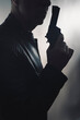 Detective spy thriller man with gun photo