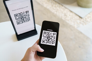 Qr code payment. E wallet. Man scanning tag accepted generate digital pay without money.scanning QR code online shopping cashless payment and verification technology concept.