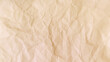 Brown crinkled paper texture background and Glued paper wrinkled effect. Background for various purposes.