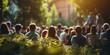 © Katrin_Primak - blurred background with a view of people sitting in a park and listening to a speaker at a conference