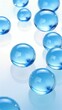 glass spheres with soft blue reflections floating on a white background