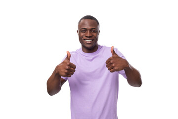 Wall Mural - young positive american man in a lilac t-shirt is inspired by an idea and success on a white background