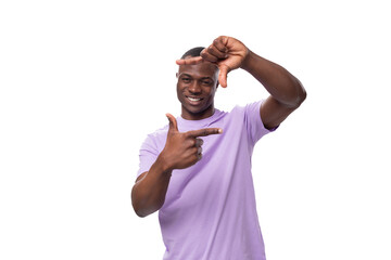 Wall Mural - young african man of normal build dressed in a basic light lilac t-shirt with print mockup