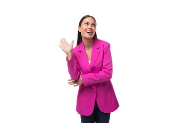 Wall Mural - young caucasian brunette with black hair is dressed in a stylish pink jacket