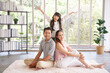 © aekkorn - Real estate and mortgage concept : Family with child having fun in new home. Joyful first-time buyers in living room. Real estate, residential mortgage, moving into dream house.