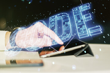 Wall Mural - creative code word sign and finger clicks on a digital tablet on background, international software 