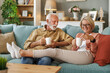 © ivanko80 - Senior couple at home drinking coffee in their new home