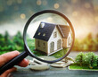 Choice of real estate to buy and invest in. House searching concept with magnifying glass. Hunt for new house or home real estate loan, mortgage and investments concept