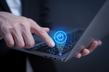 turn on laptop or program by a person pressing the turn off or on button in holographic to access data and manage by business style 