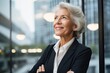Confident senior businesswoman looking ahead with optimism at the office