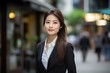 © yj - An elegant asian businesswoman with modern fashion. her serenity and sophistication on full display amidst the urban environment. generative AI
