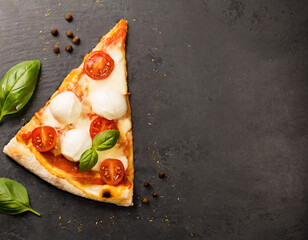 Wall Mural - Hot pizza slice with melted mozzarella cheese and tomato on black concrete background. Pizza Ready to Eat, Copyspace..