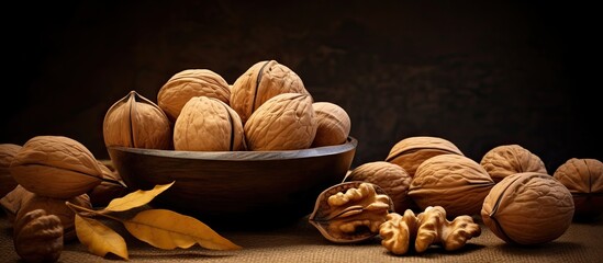 Canvas Print - The dramatic contrast of the background highlights the presence of natural walnuts still in their shells