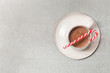 Christmas chocolate milk mug with candy cane stick, concept of winter holidays desserts and decoration