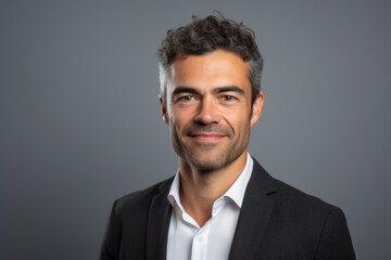 Poster - Handsome business man over grey background. Looking at camera.