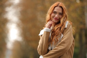 Poster - Autumn vibes. Portrait of beautiful woman outdoors. Space for text