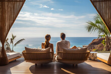 Rear View Of Couple Relaxing On Couch In Luxury Hotel. Summer, Holiday, Relax And Lifestyle Concept