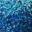 Blue sparkle glitter sequins background. Magenta backdrop with palliettes. Scattered аrom above close-up