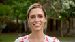 © SERGEI - Beautiful 30s woman portrait. Pretty american girl look at camera. White teeth smile close up. Cute joy blond person head shot. One nice lady walking at park. Happy female face. Young adult 20s model.