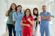 © RomanR - Happy caucasian medical students talking at corridor of medical university