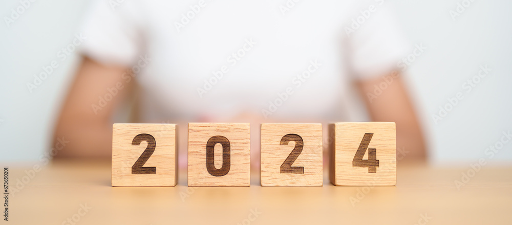 2024 year block on table. goal, Resolution, strategy, plan, start, budget, mission, action, motivation and New Year concepts
