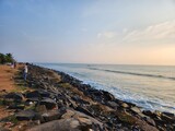 Fototapeta Desenie - Puducherry, India - Oct 17 2023: Sun rise at Rock Beach in Pondicherry.