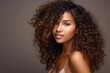 © arhendrix - African beautiful woman portrait. Brunette curly haired young model with dark skin and perfect smile.