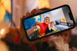 © Westend61 - Mother and daughter taking selfie on smart phone at home during Christmas